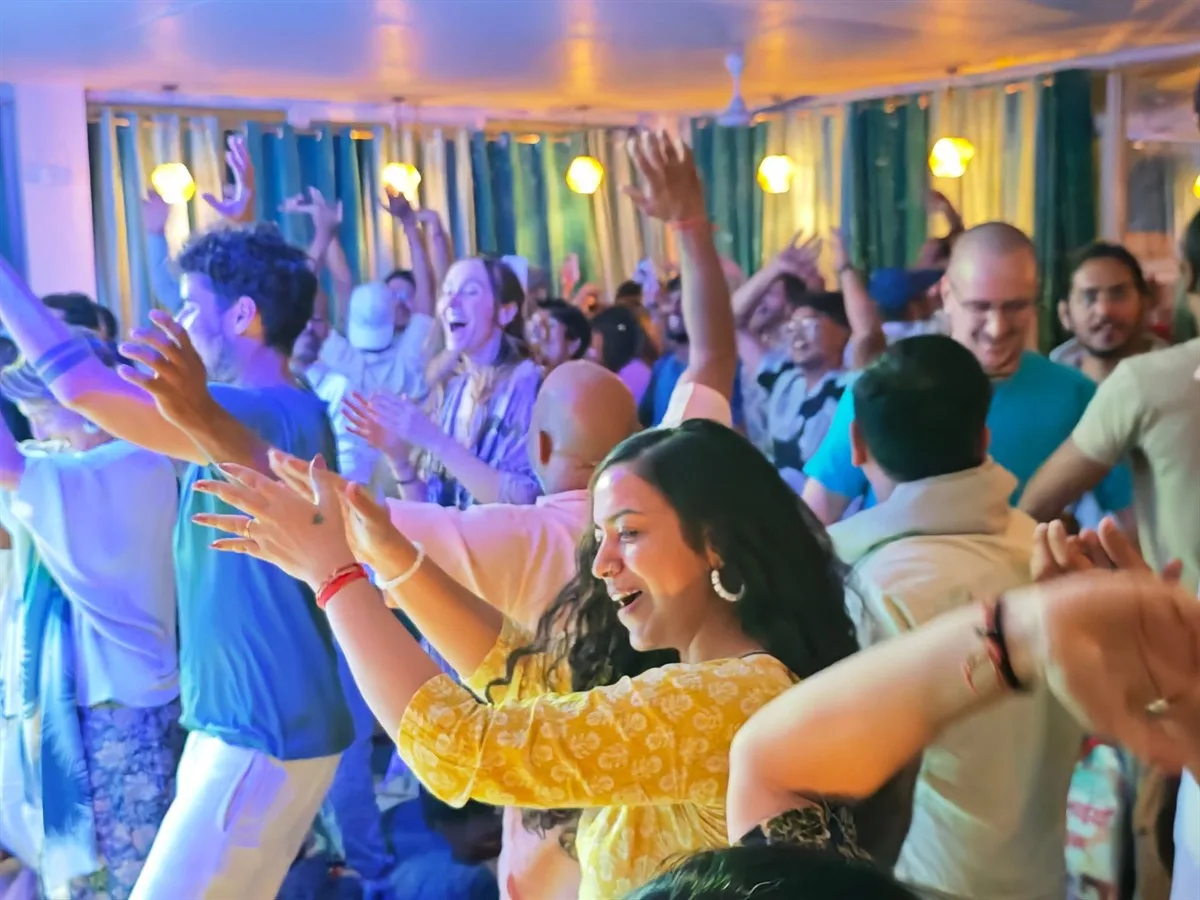 A joyful crowd dancing at the annual Kirtan Mela in Rishikesh