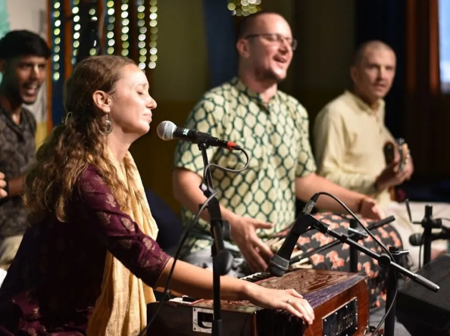 Kirtan singers with harmonium at a weekly Bhakti Yoga Rishikesh gathering
