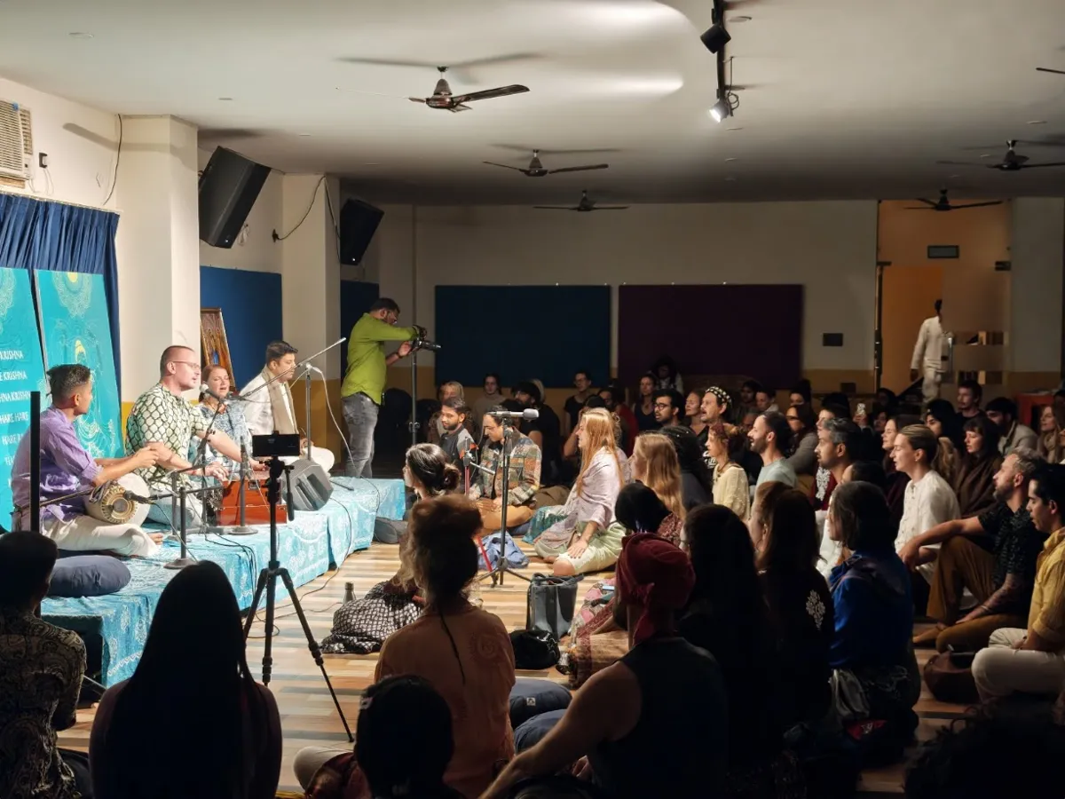 The Bhakti Yoga Rishikesh community gathered in the hall for an evening program