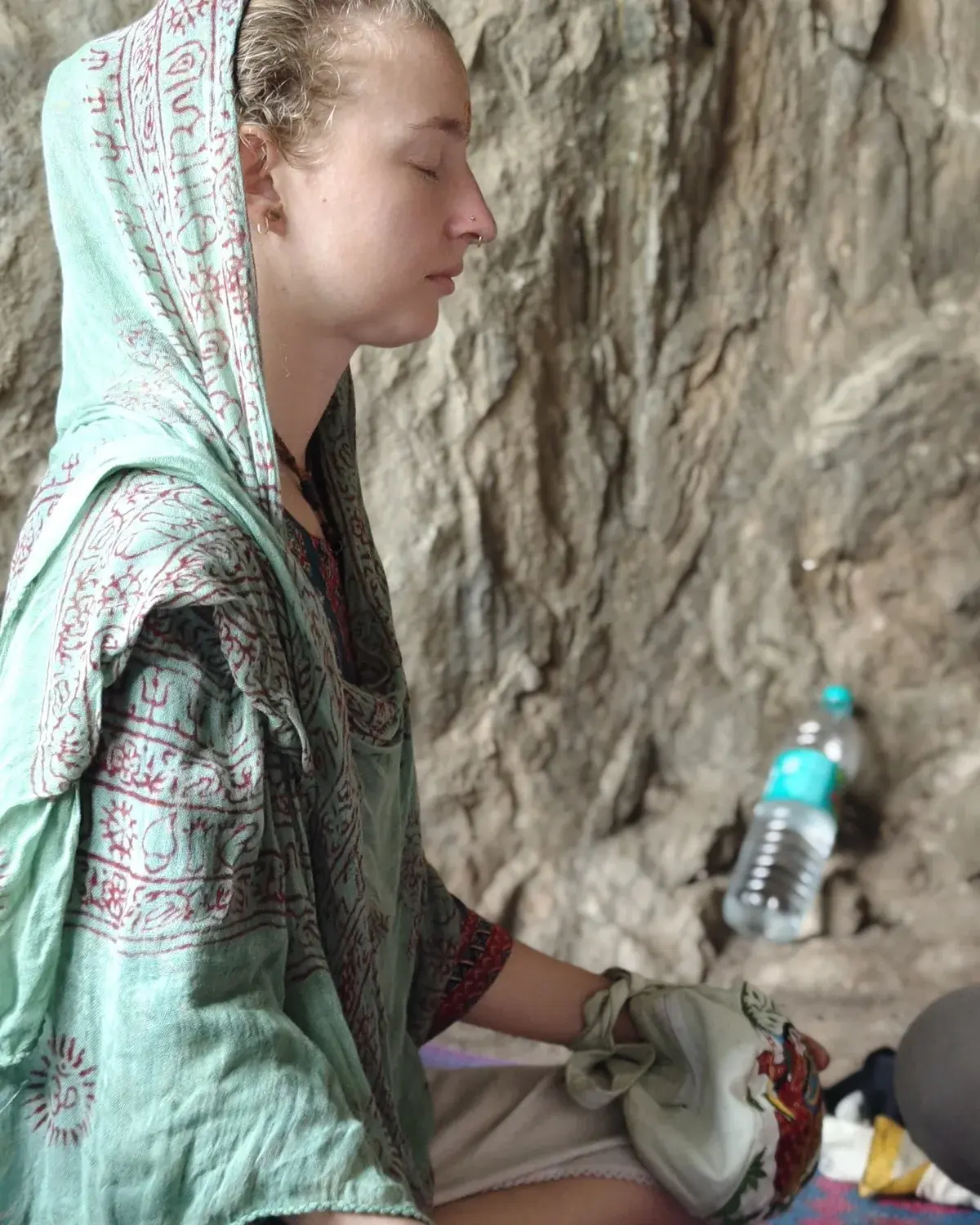 A woman in meditation at the ashram