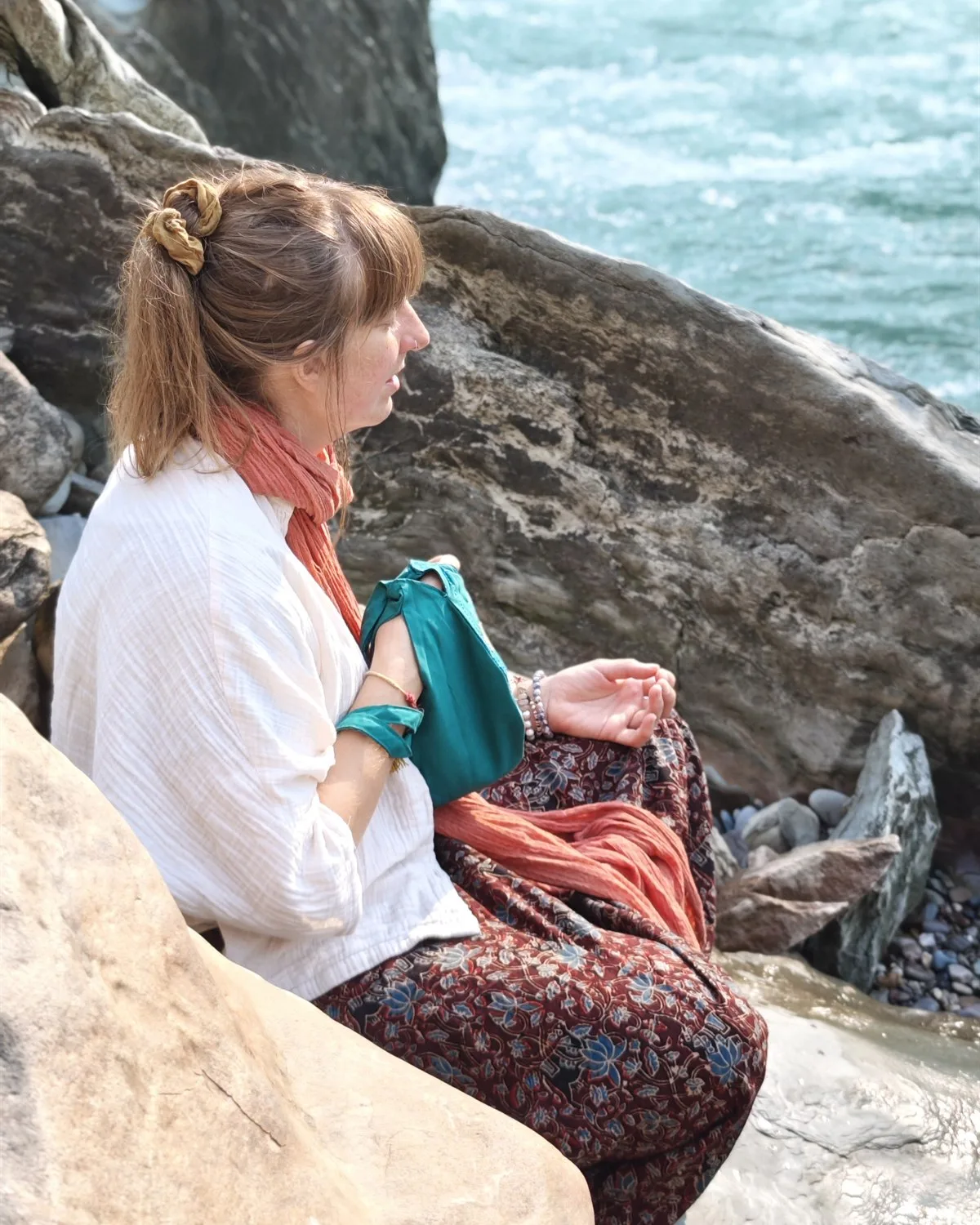 Quiet reflection beside the Ganga with a journal