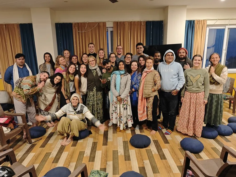 The whole community together after an evening of kirtan