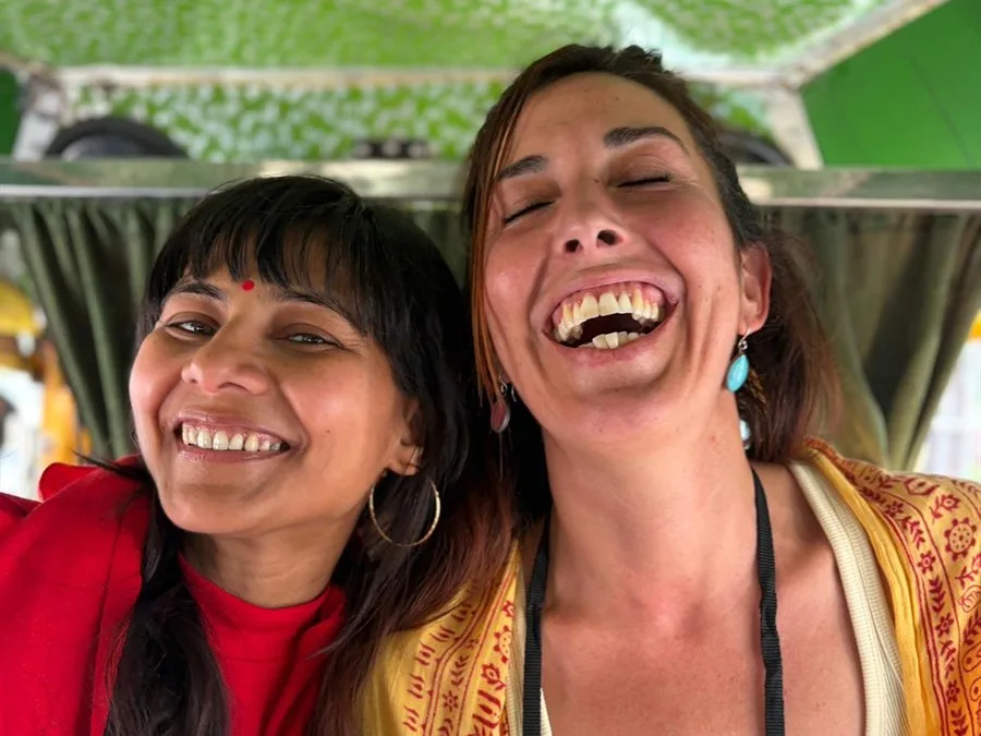 Two friends laughing on the way home from satsang