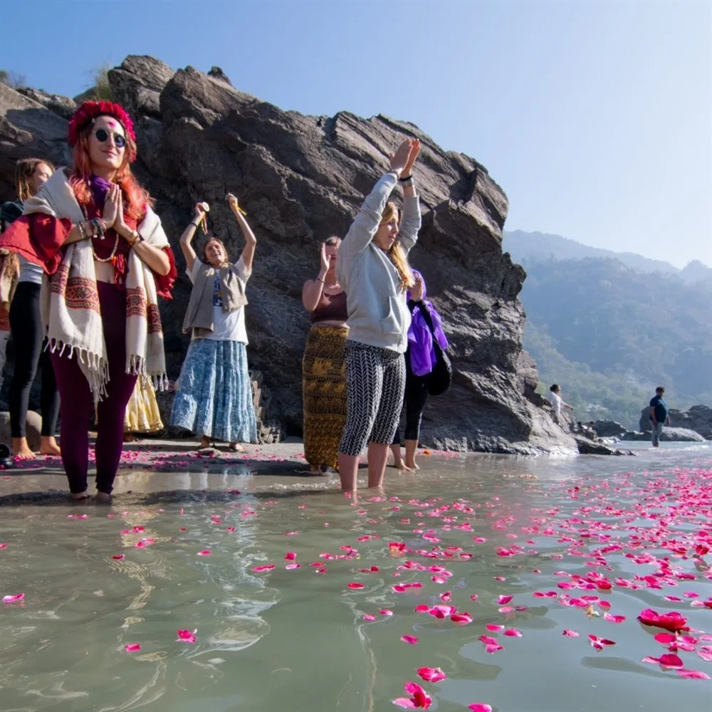 Sacred river ceremony with flower petals